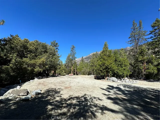 a view of side of snow with a yard