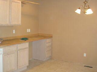 10050 South Naches Road Naches, WA 98937 - Photo 3 of 4 a kitchen with a sink and cabinets