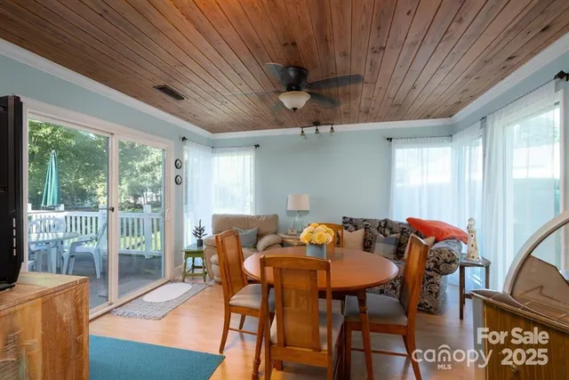 a dining room with furniture and wooden floor
