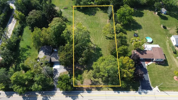 an aerial view of houses with yard