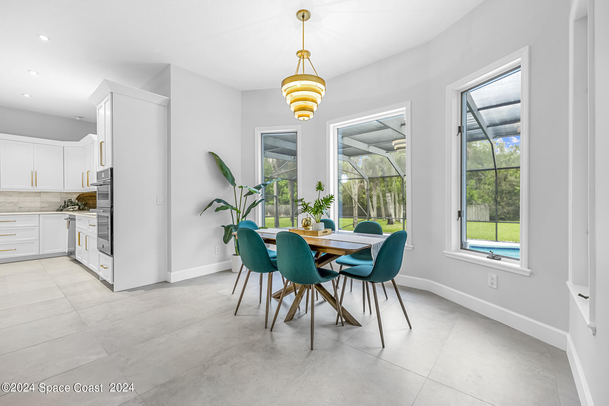 3671 Big Pine Road Melbourne, FL 32934 - Photo 12 of 60 a view of a dining room with furniture window and outside view