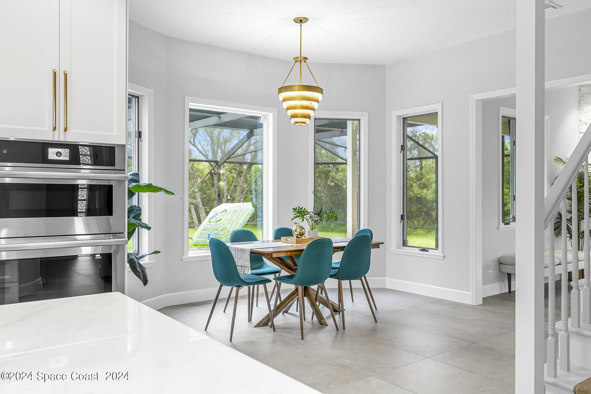 3671 Big Pine Road Melbourne, FL 32934 - Photo 13 of 60 a view of a dining room with furniture window and outside view