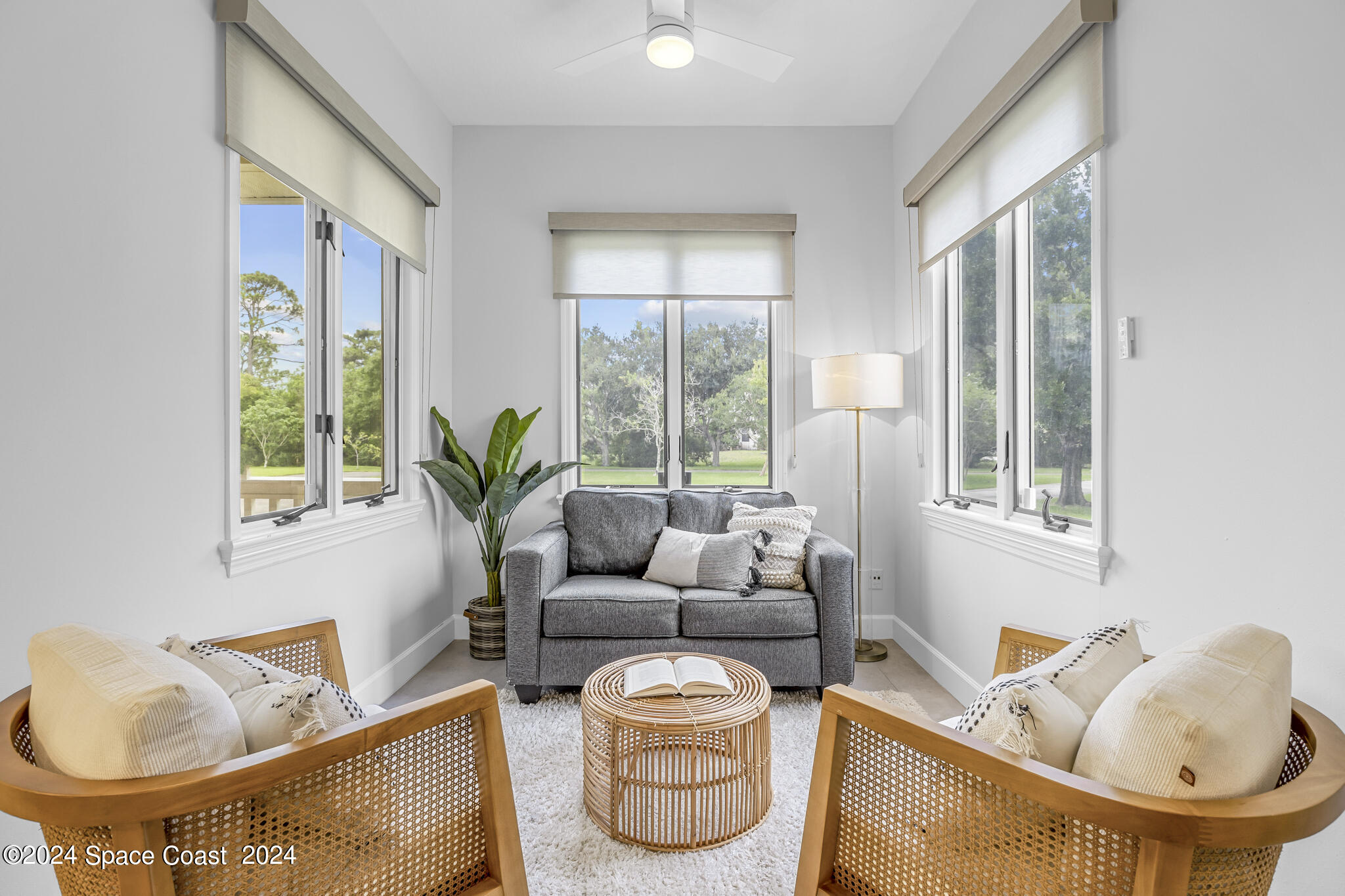3671 Big Pine Road Melbourne, FL 32934 - Photo 25 of 60 a living room with furniture and a potted plant
