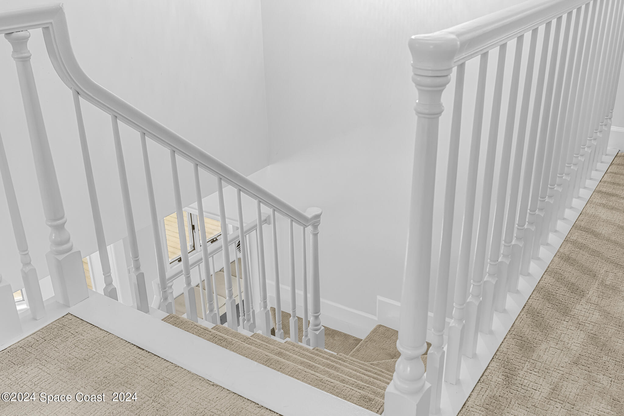 3671 Big Pine Road Melbourne, FL 32934 - Photo 29 of 60 a view of staircase with railing and white walls