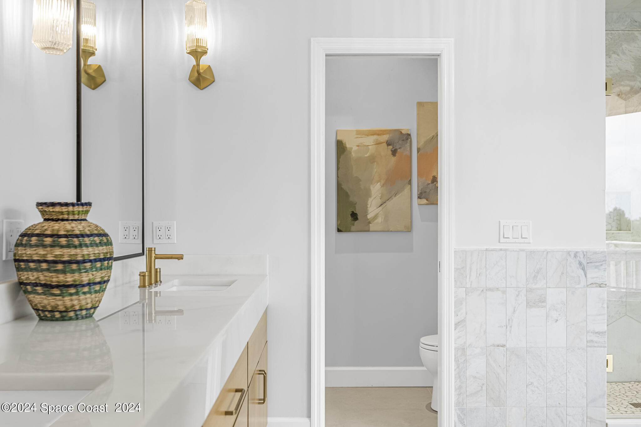 3671 Big Pine Road Melbourne, FL 32934 - Photo 34 of 60 a bathroom with a sink and a mirror