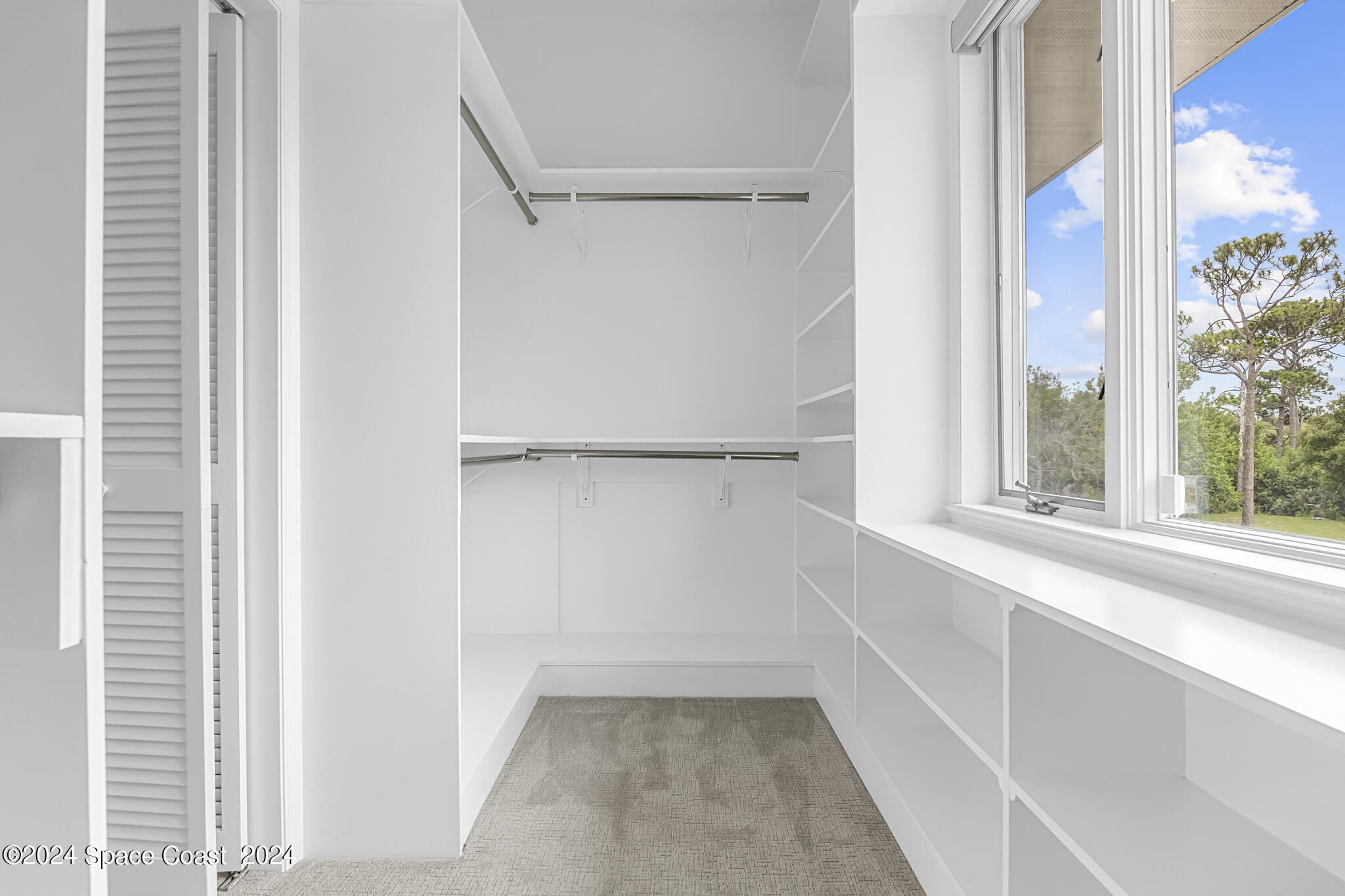 3671 Big Pine Road Melbourne, FL 32934 - Photo 38 of 60 a view of a closet in a room