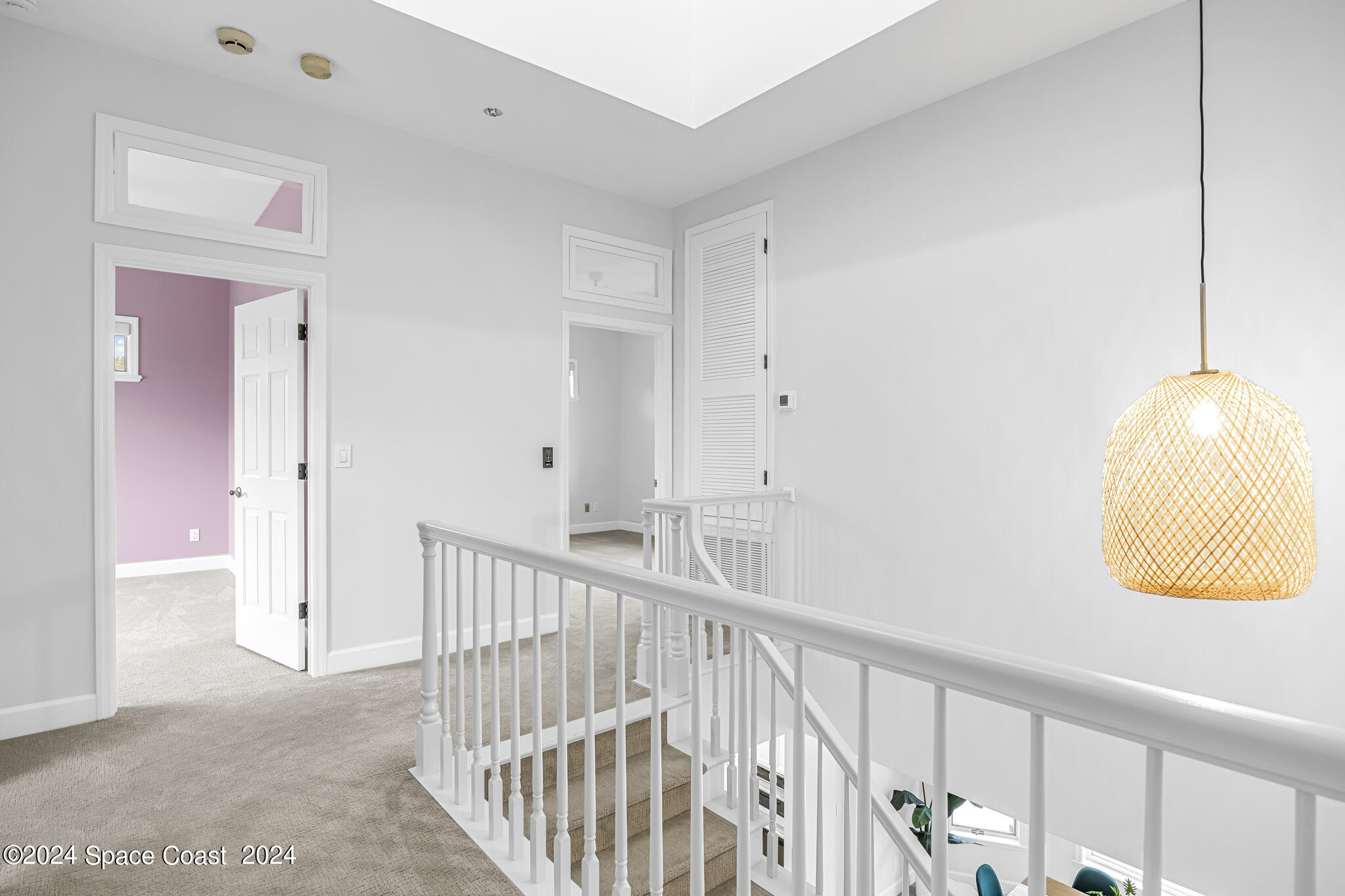 3671 Big Pine Road Melbourne, FL 32934 - Photo 41 of 60 a view of a hallway with staircase