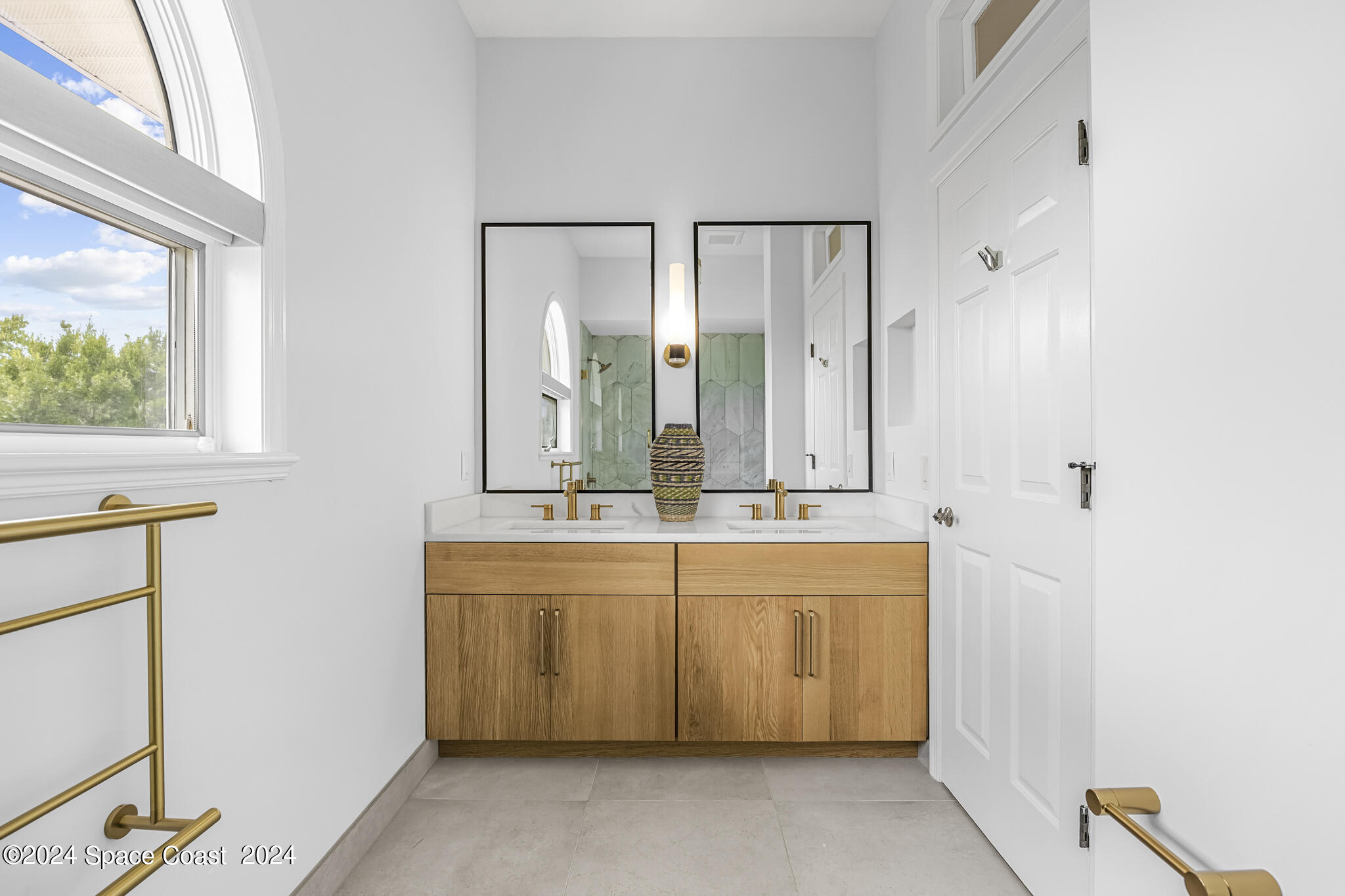 3671 Big Pine Road Melbourne, FL 32934 - Photo 45 of 60 a bathroom with a double vanity sink mirror and double