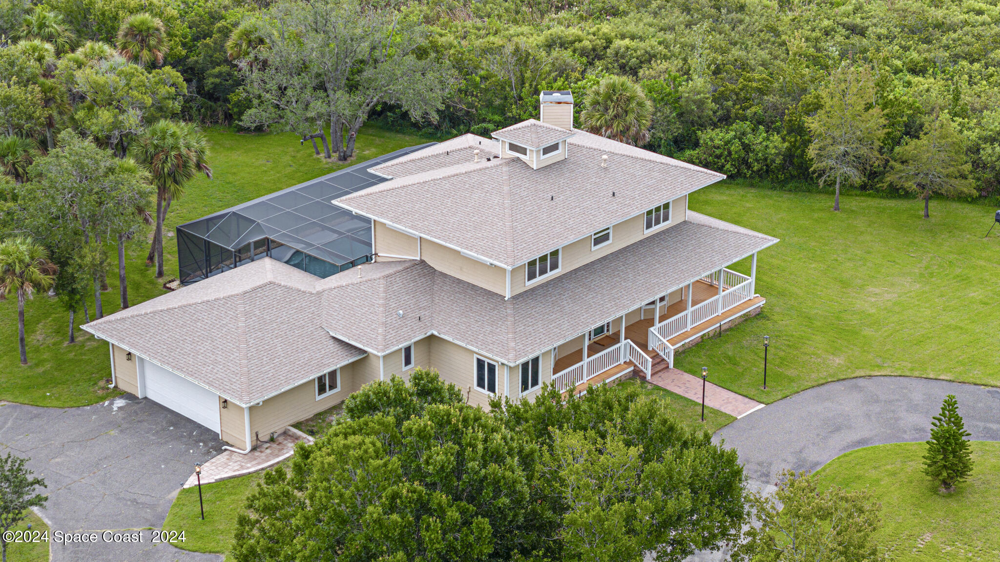3671 Big Pine Road Melbourne, FL 32934 - Photo 56 of 60 an aerial view of a house with a big yard