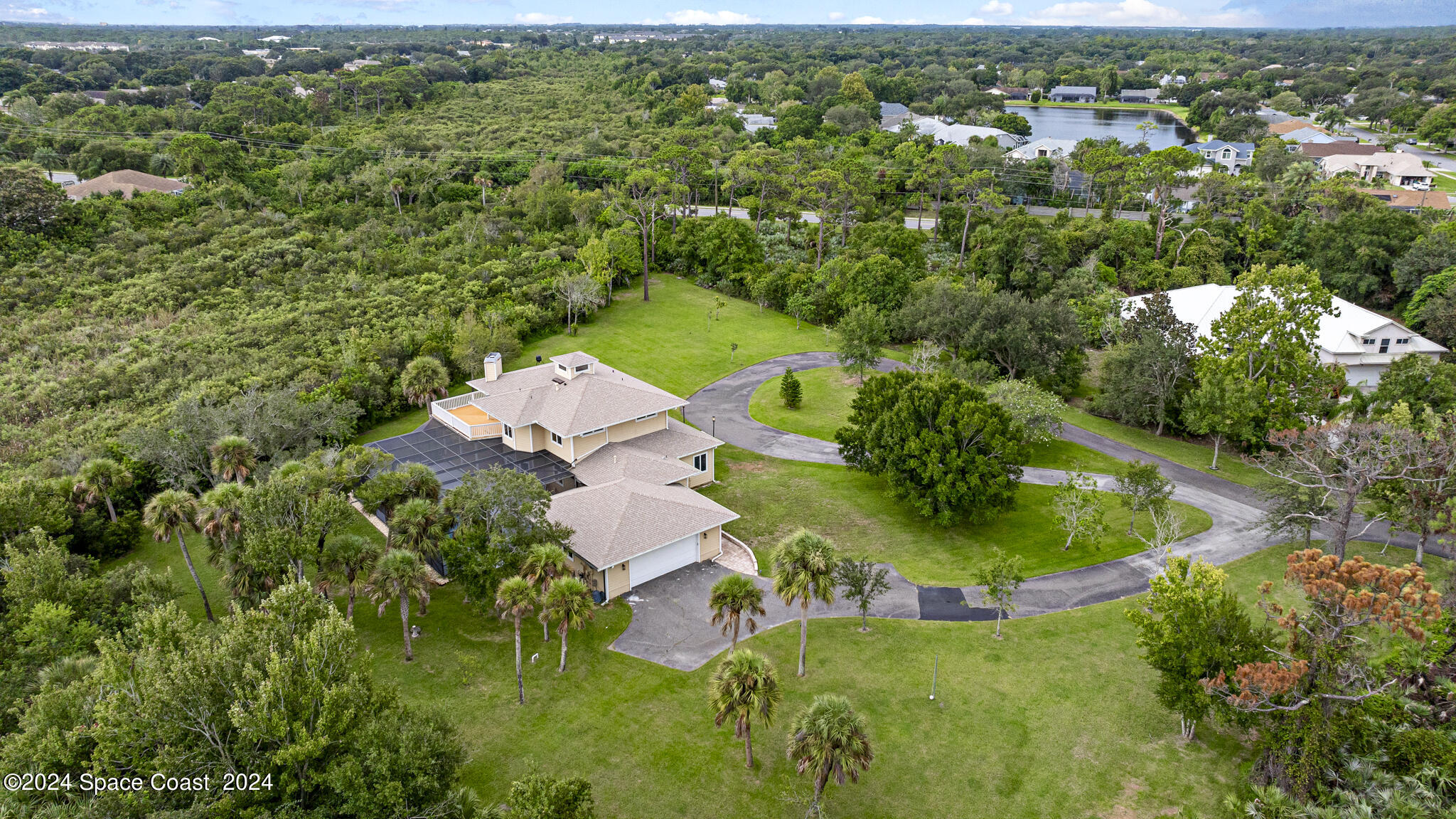 3671 Big Pine Road Melbourne, FL 32934 - Photo 57 of 60 an aerial view of residential house with outdoor space and trees all around
