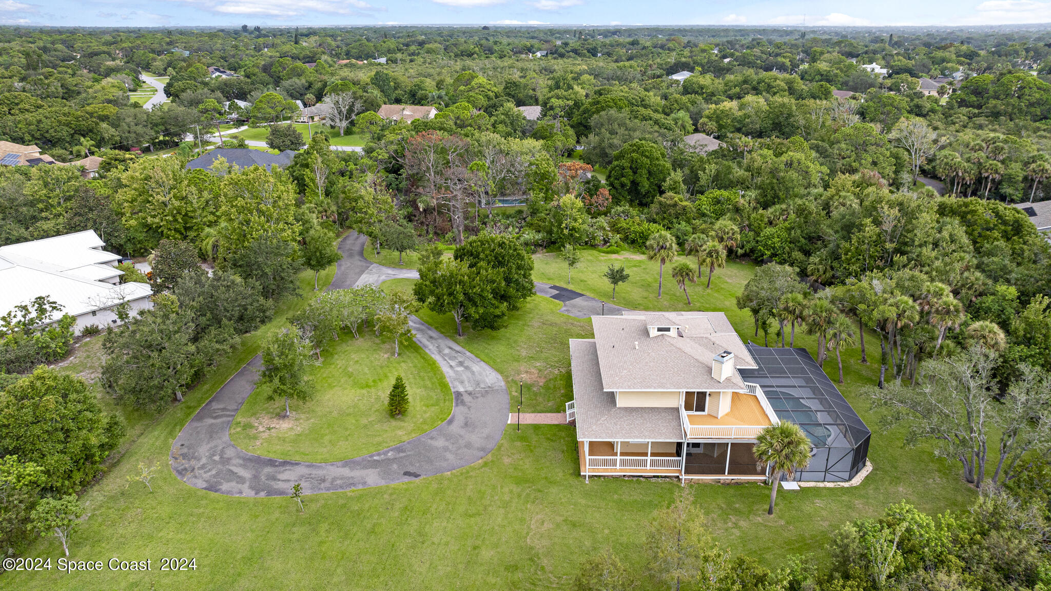 3671 Big Pine Road Melbourne, FL 32934 - Photo 60 of 60 an aerial view of a house with a yard