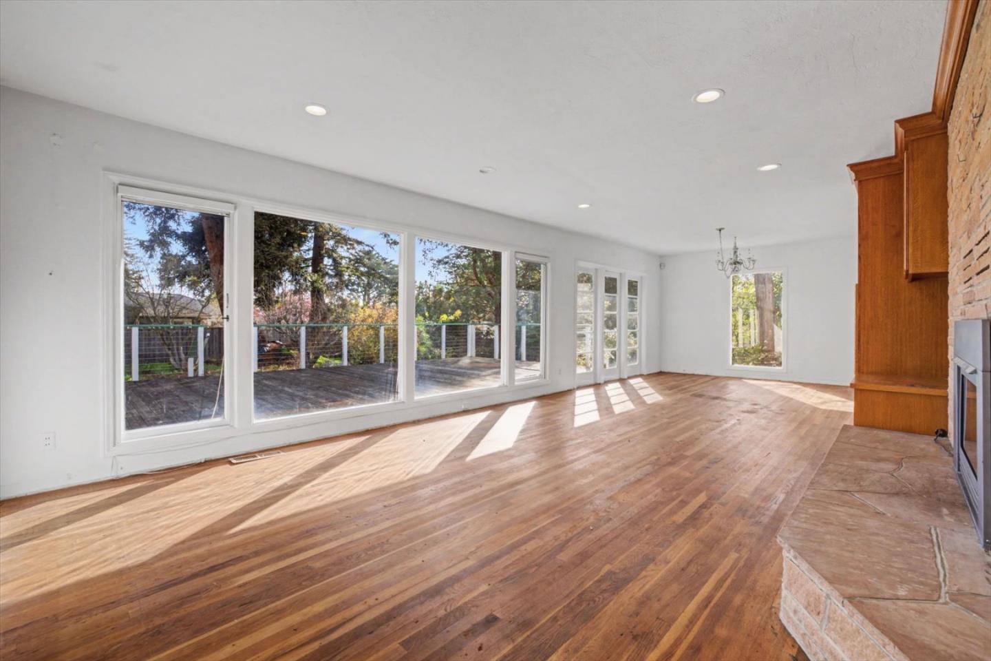 416 Spring Street Santa Cruz, CA 95060 - Photo 12 of 28 a view of an empty room with window and wooden floor