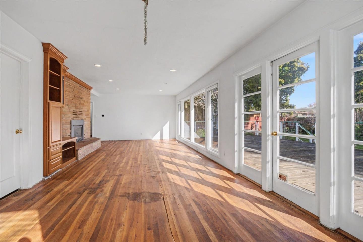 416 Spring Street Santa Cruz, CA 95060 - Photo 13 of 28 a view of empty room with wooden floor and fan