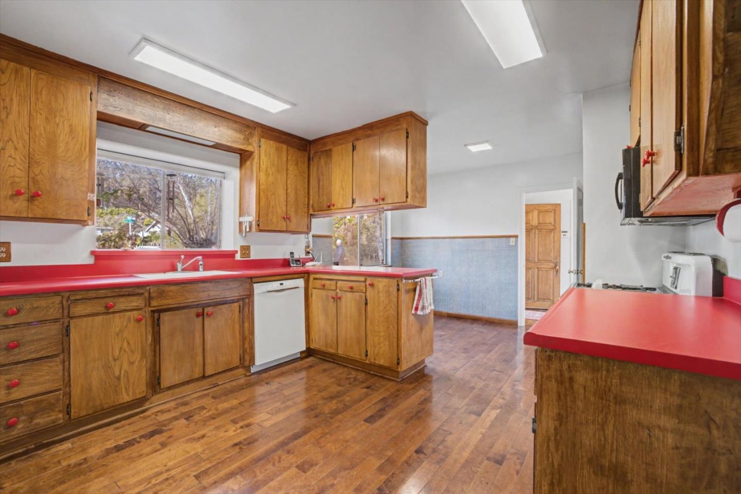416 Spring Street Santa Cruz, CA 95060 - Photo 15 of 28 a kitchen with a sink stove and cabinets