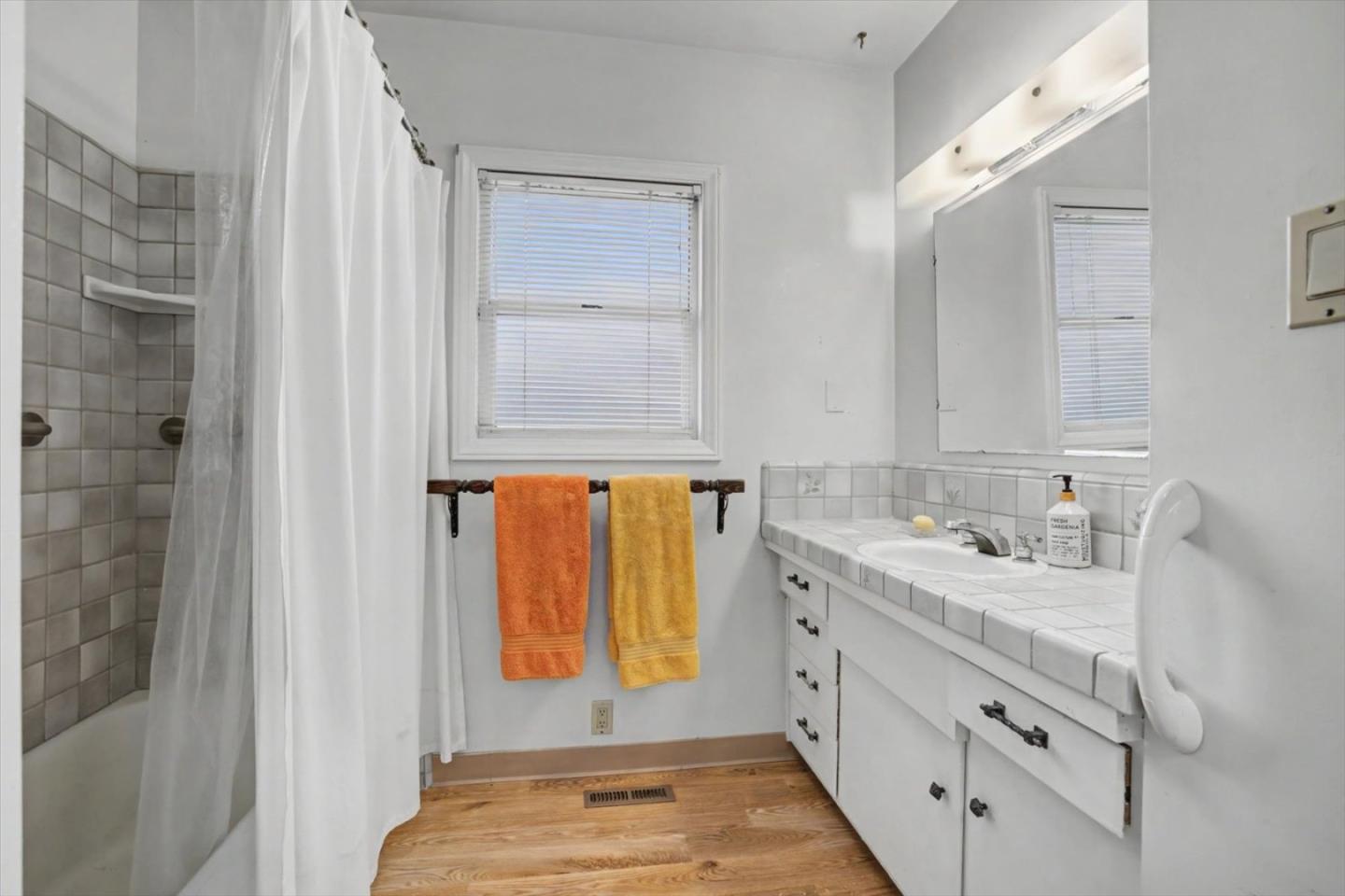 416 Spring Street Santa Cruz, CA 95060 - Photo 21 of 28 a bathroom with a sink and a mirror