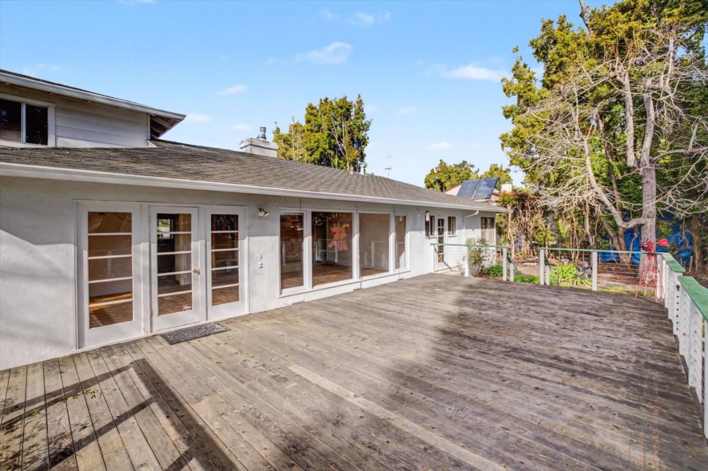 416 Spring Street Santa Cruz, CA 95060 - Photo 24 of 28 a view of a house with a large window and wooden fence