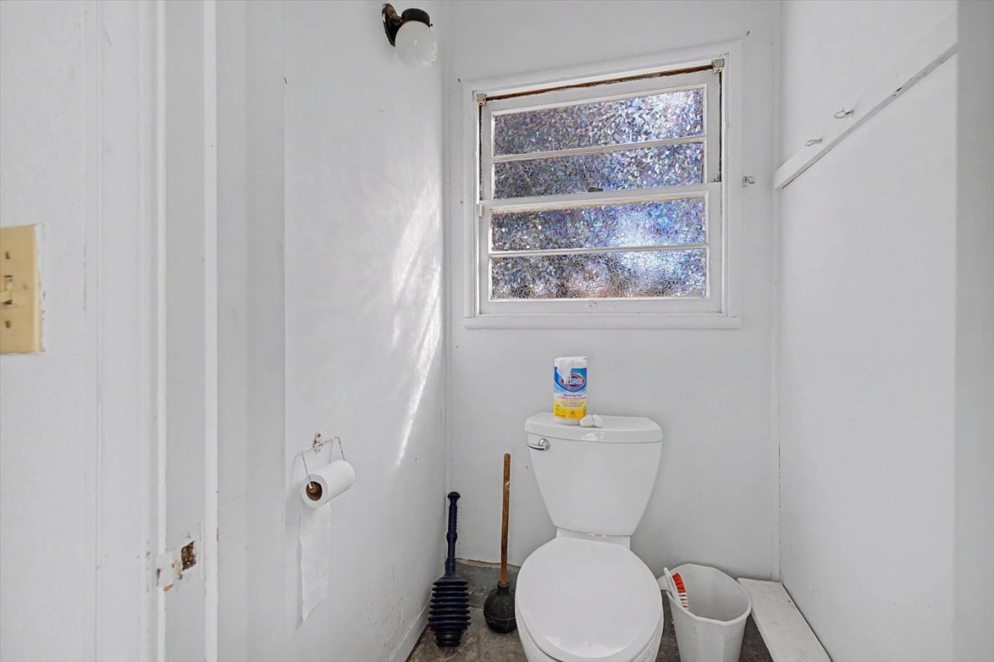 416 Spring Street Santa Cruz, CA 95060 - Photo 26 of 28 a white toilet sitting next to a bathroom sink