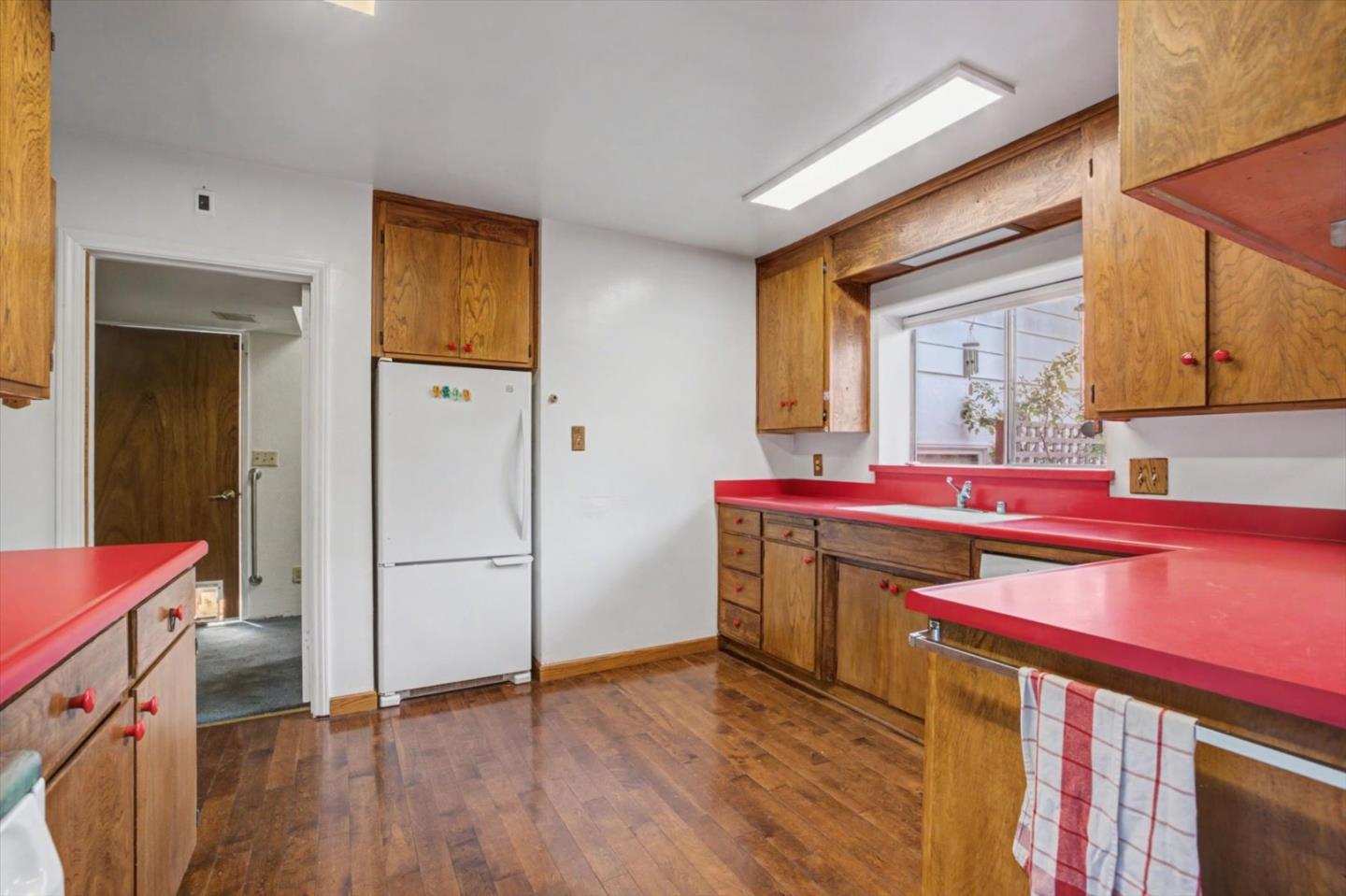 416 Spring Street Santa Cruz, CA 95060 - Photo 27 of 28 a kitchen that has a lot of cabinets and wooden floor