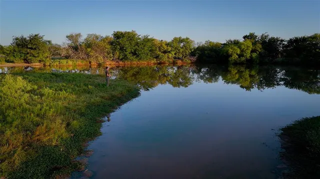 a view of a lake with a city