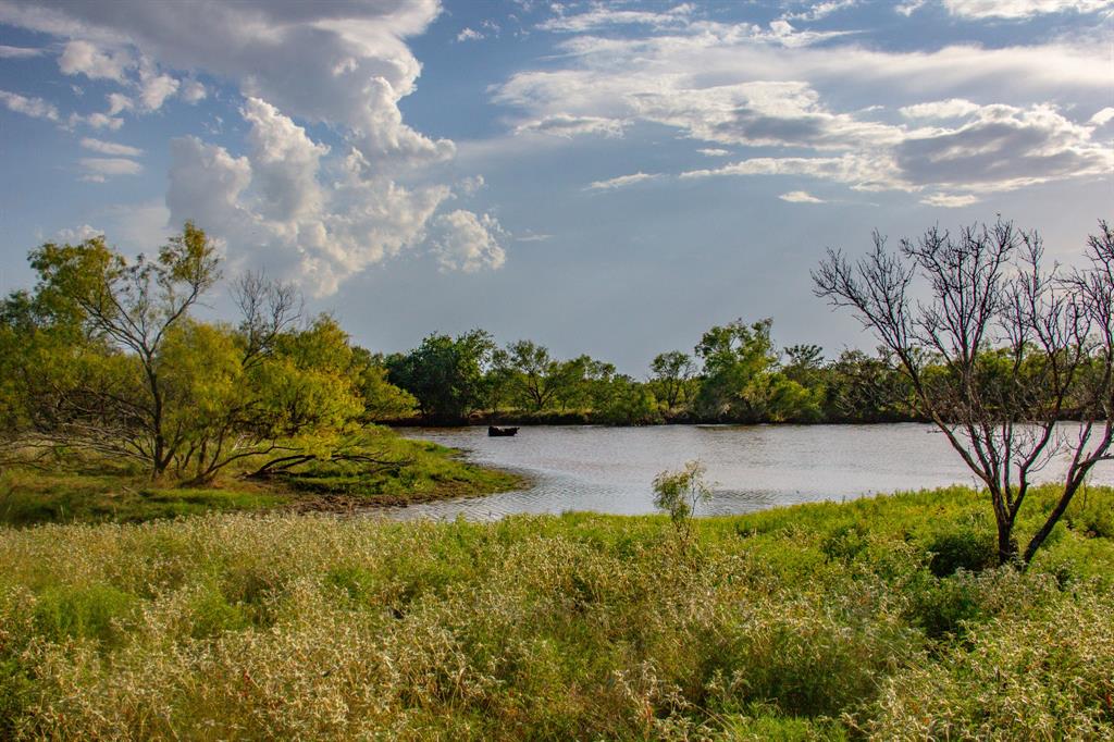 Tbd Gilbert Road Nocona, TX 76255 - Photo 31 of 40 a view of a lake with houses in the back