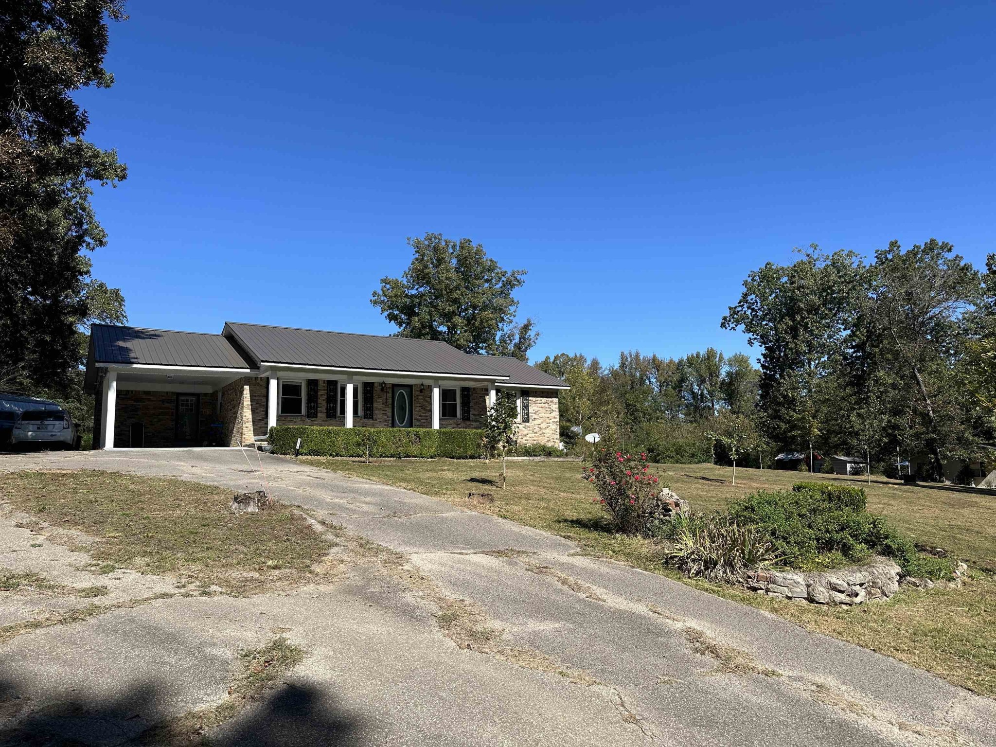 155 Lewter Road Crump, TN 38327 - Photo 2 of 33 a front view of a house with a yard
