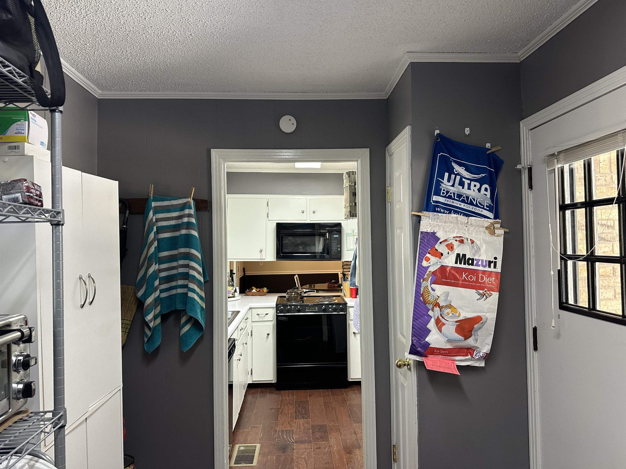 155 Lewter Road Crump, TN 38327 - Photo 23 of 33 a kitchen with a refrigerator and a stove top oven
