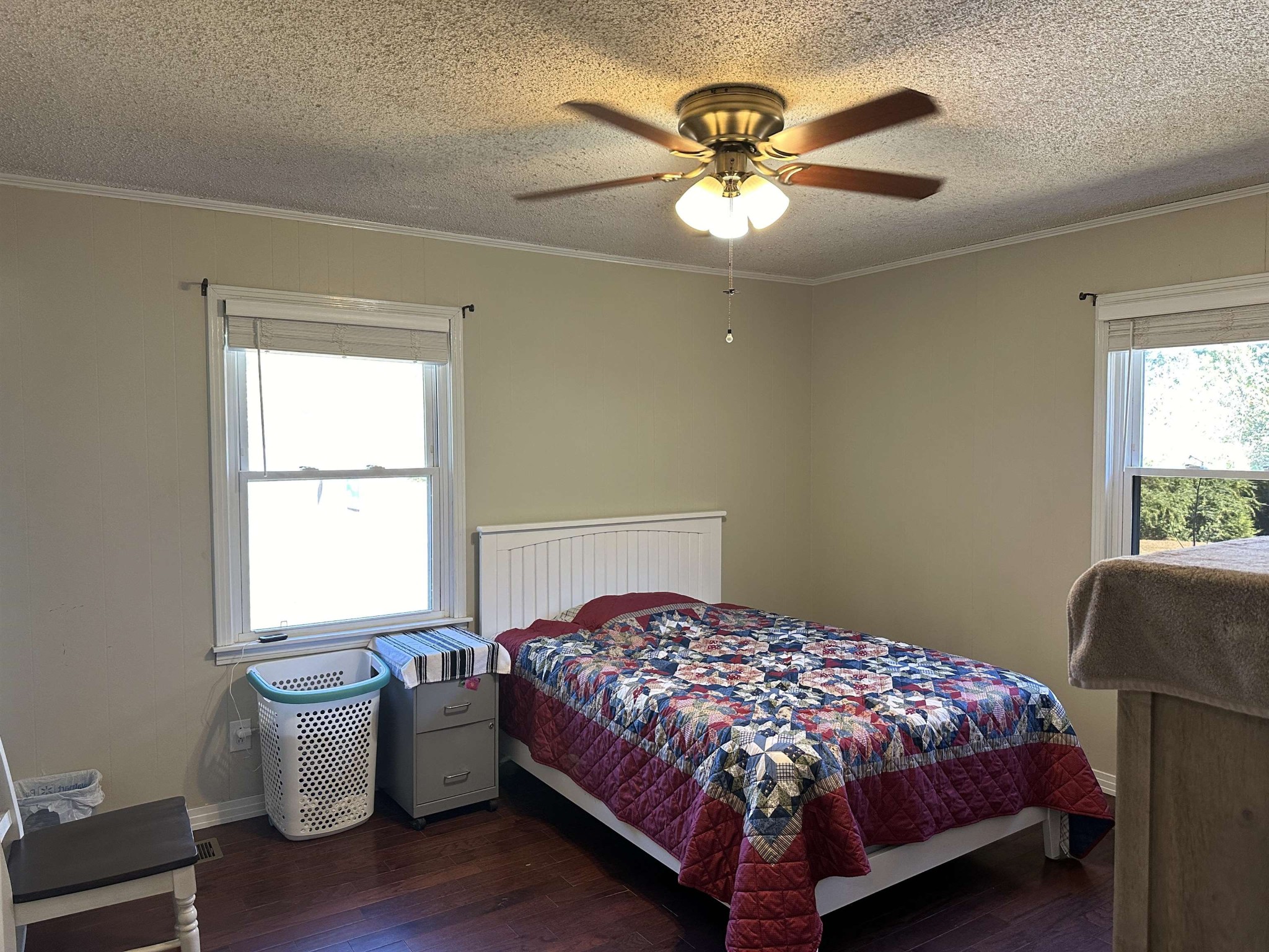 155 Lewter Road Crump, TN 38327 - Photo 29 of 33 a bedroom with a bed and a chandelier