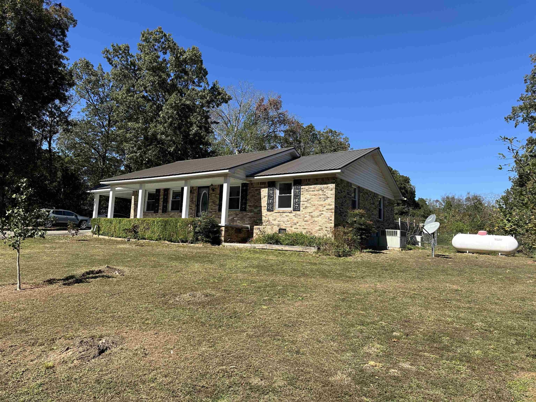 155 Lewter Road Crump, TN 38327 - Photo 3 of 33 a front view of a house with a yard