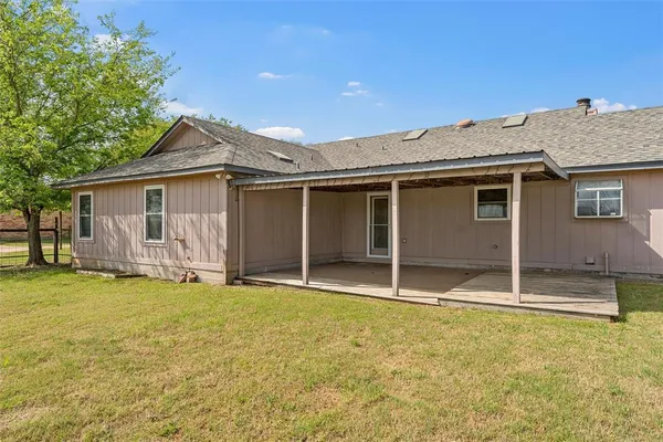 a house with swimming pool in front of it