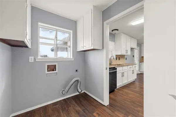 a kitchen with stainless steel appliances granite countertop a stove a sink and a window