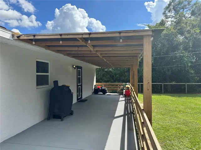 a view of swimming pool with seating space