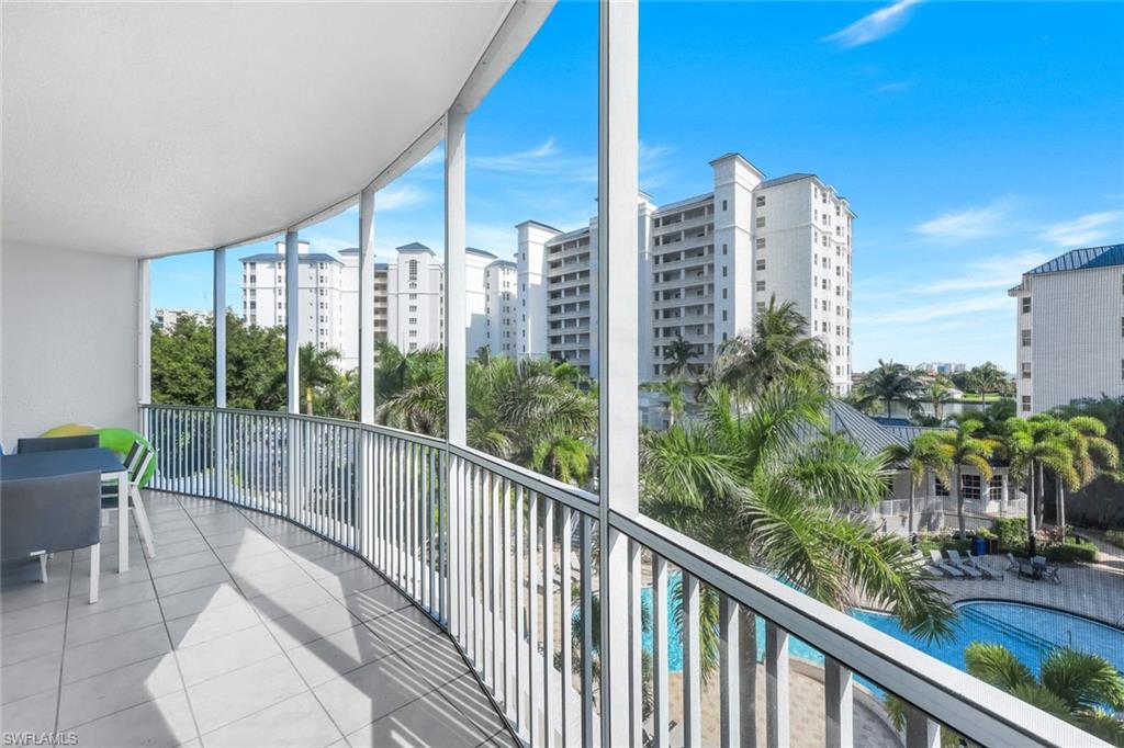 470 Launch Circle, Unit 403 Naples, FL 34108 - Photo 17 of 32 a view of balcony with chairs