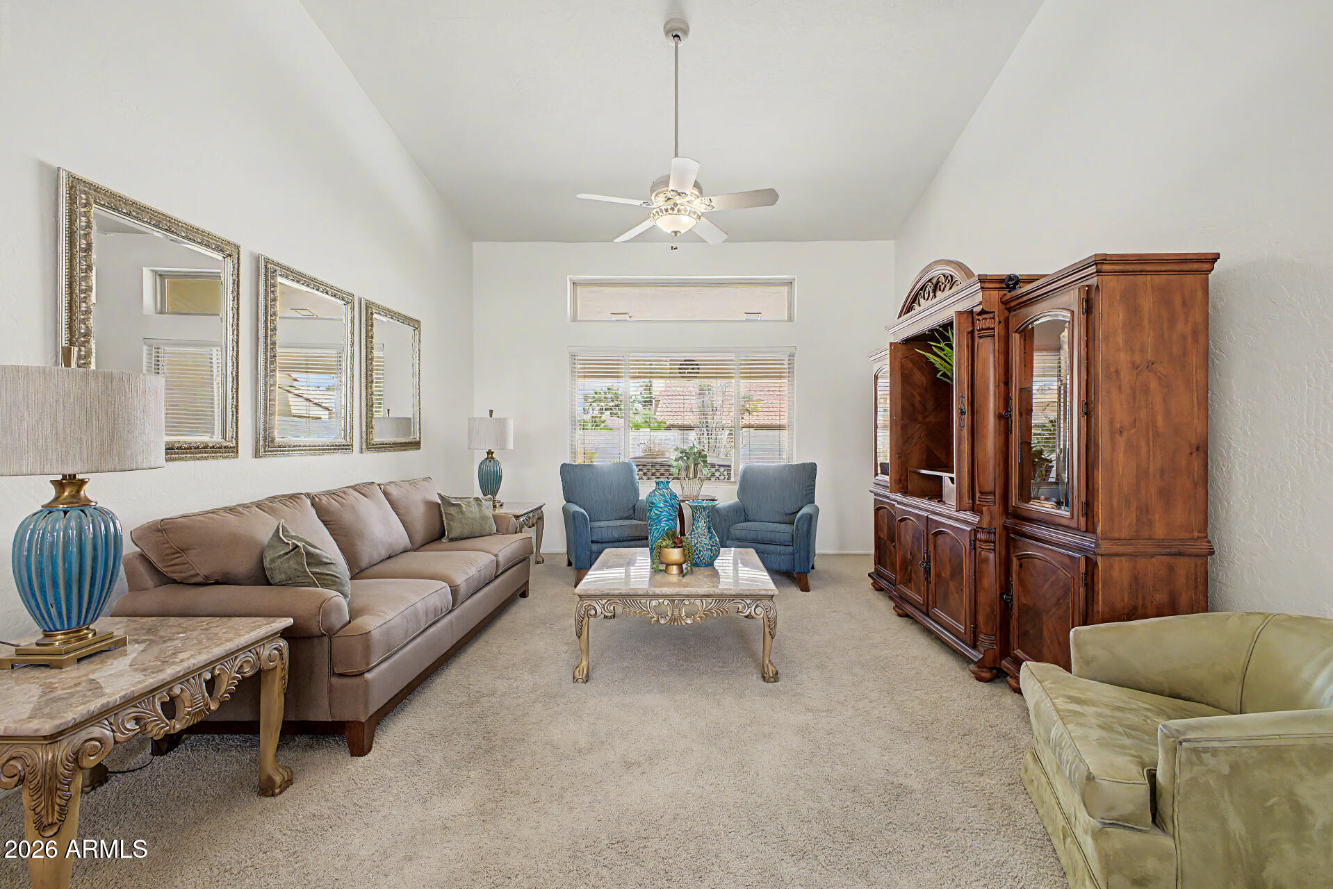 1924 East El Freda Road Tempe, AZ 85284 - Photo 22 of 56 a living room with furniture ceiling fan and a window
