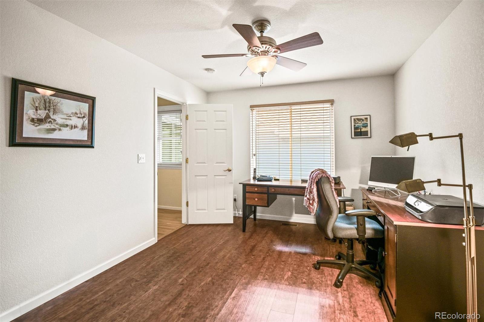 10230 Rustic Redwood Way Highlands Ranch, CO 80126 - Photo 19 of 50 a workspace with wooden floor