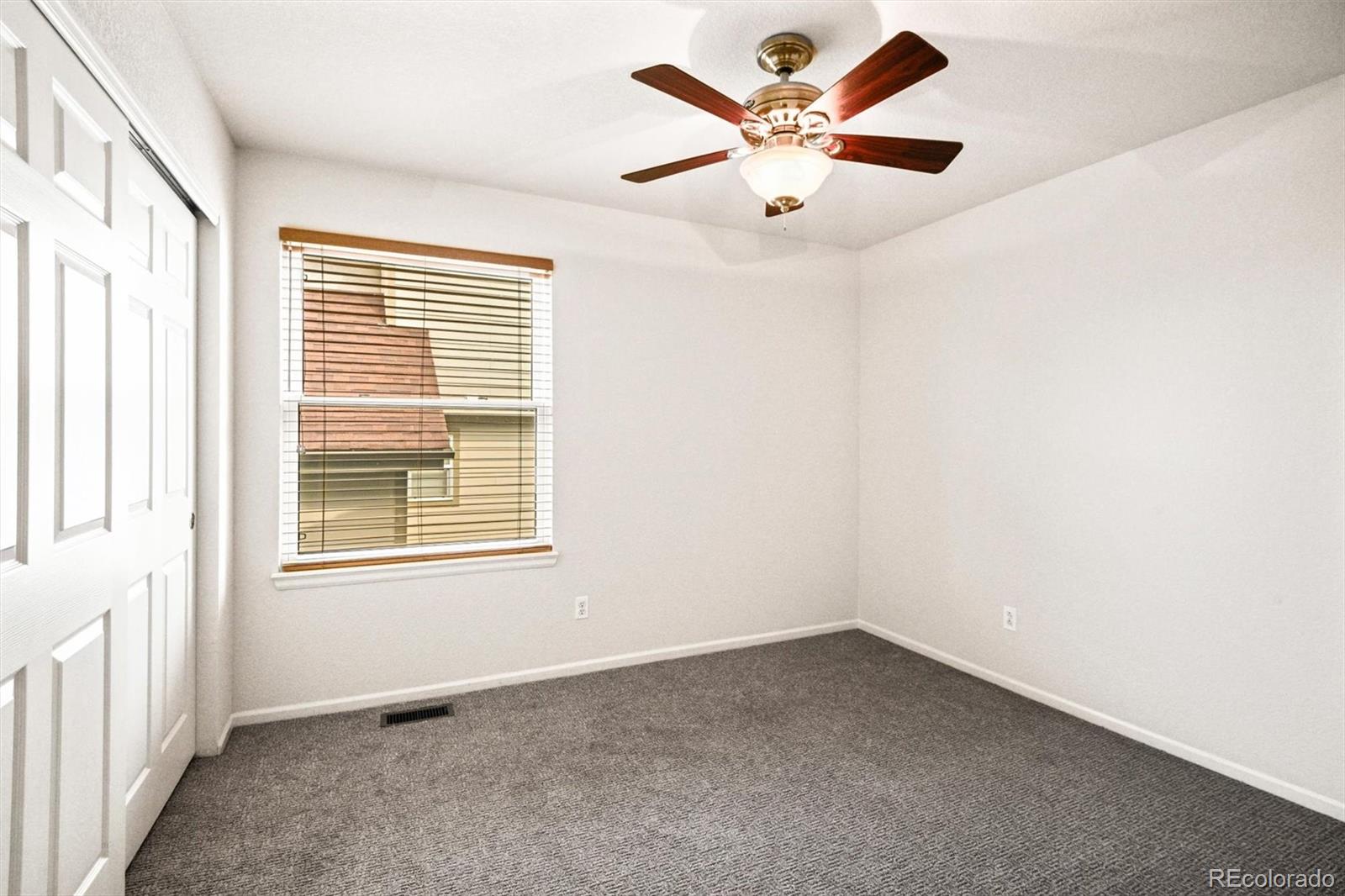 10230 Rustic Redwood Way Highlands Ranch, CO 80126 - Photo 25 of 50 an empty room with a window