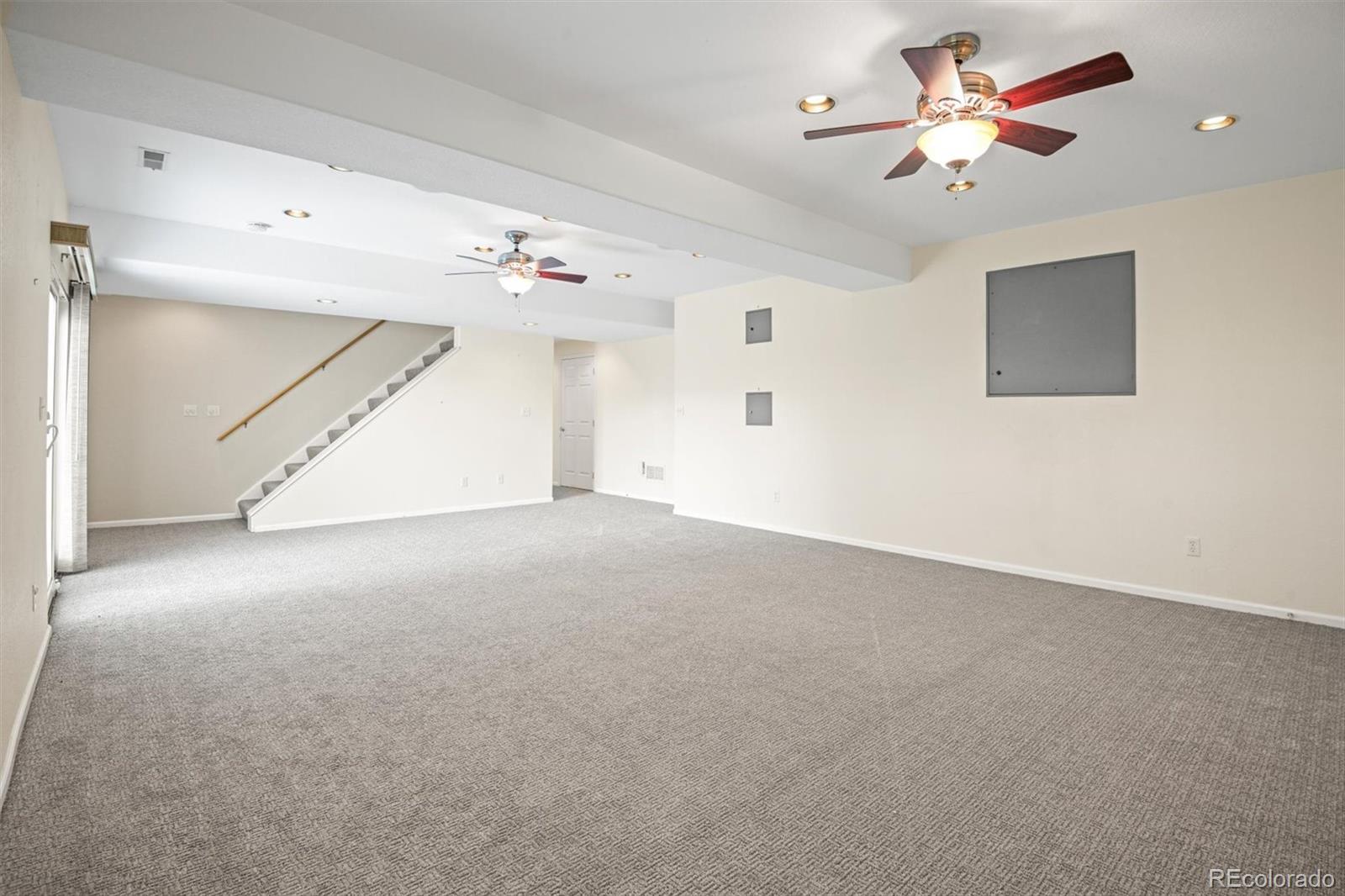 10230 Rustic Redwood Way Highlands Ranch, CO 80126 - Photo 32 of 50 an empty room with a ceiling fan and a window