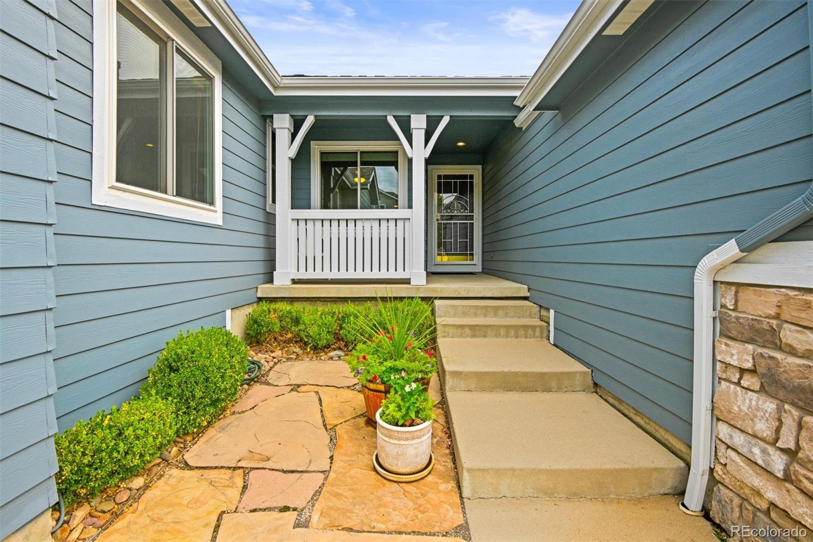 10230 Rustic Redwood Way Highlands Ranch, CO 80126 - Photo 4 of 50 a front view of a house