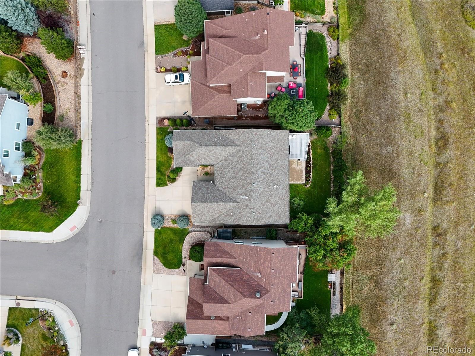 10230 Rustic Redwood Way Highlands Ranch, CO 80126 - Photo 48 of 50 an aerial view of a house with a garden