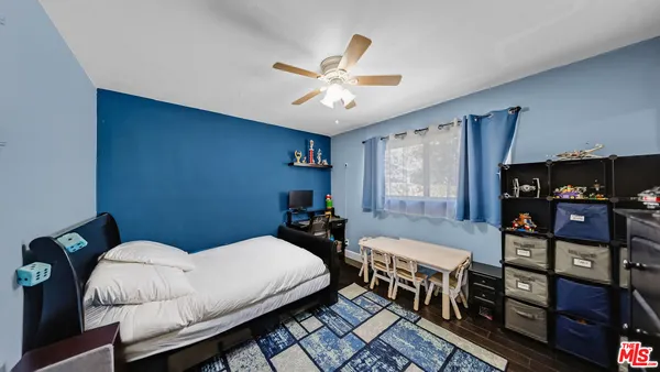 a bedroom with bed and a window