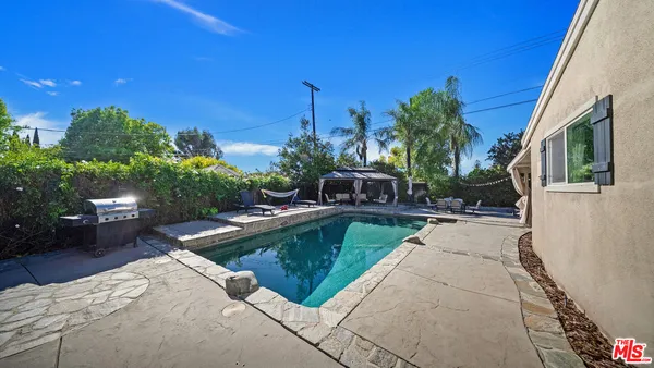 a view of a house with swimming pool