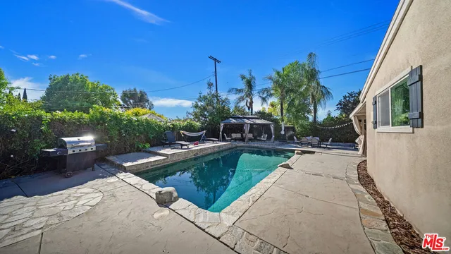 a view of a house with swimming pool