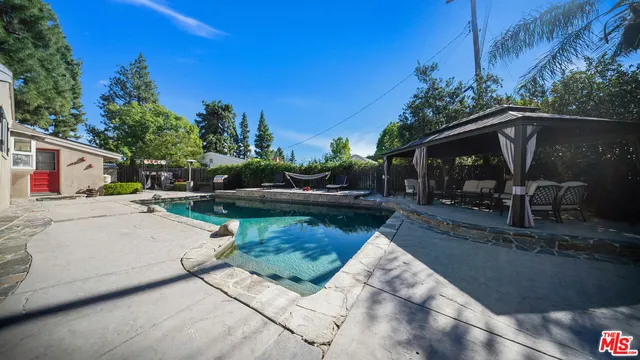 a view of swimming pool from a patio