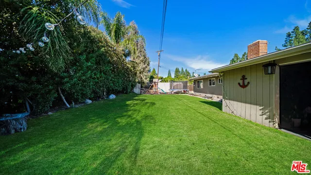 a view of a back yard of the house