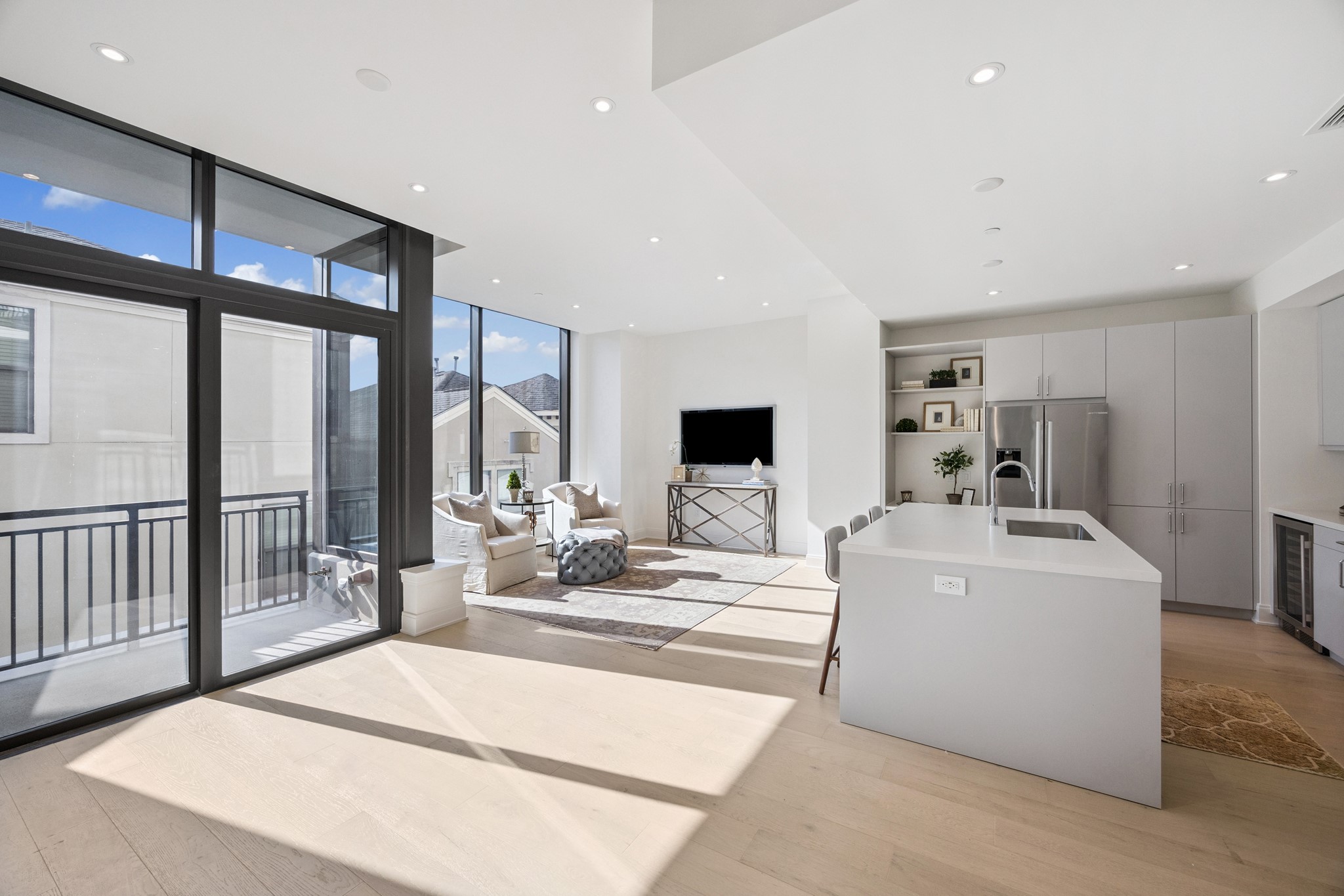 2323 West Main Street, Unit 305 Houston, TX 77098 - Photo 3 of 17 Kitchen is complete with built-in home hub area and quartz countertops. All residences come with Bosch SS appliances, full-sized W/Ds and Italian cabinetry.