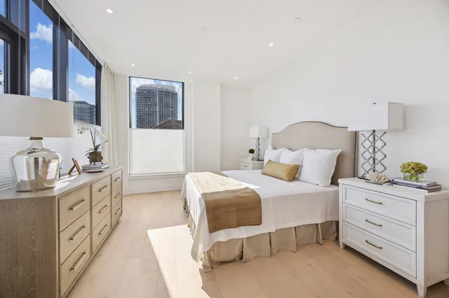 a bedroom with a bed and a cabinets