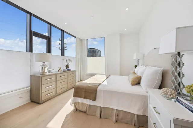 a bedroom with a bed and a dresser