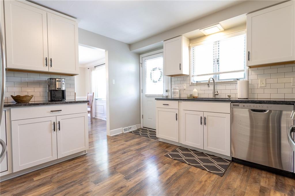 216 McCombs Road Venetia, PA 15367 - Photo 10 of 32 a kitchen with granite countertop white cabinets and white appliances