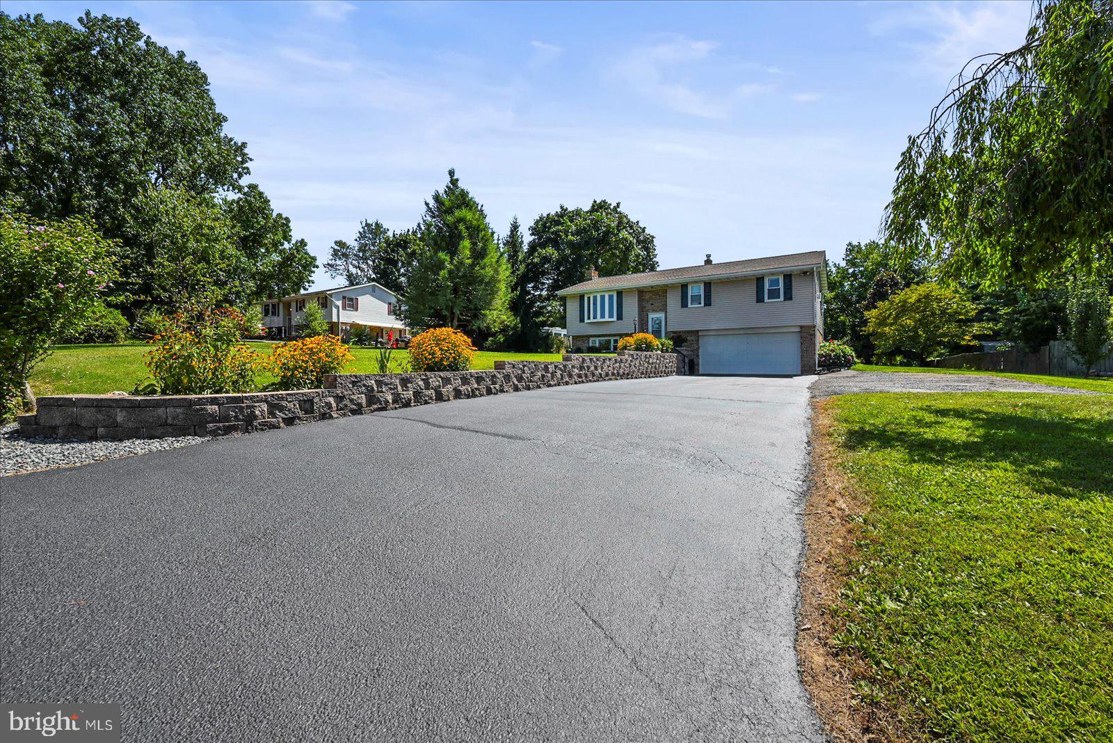 253 Kindig Road Littlestown, PA 17340 - Photo 3 of 41 Charming home with lush greenery.