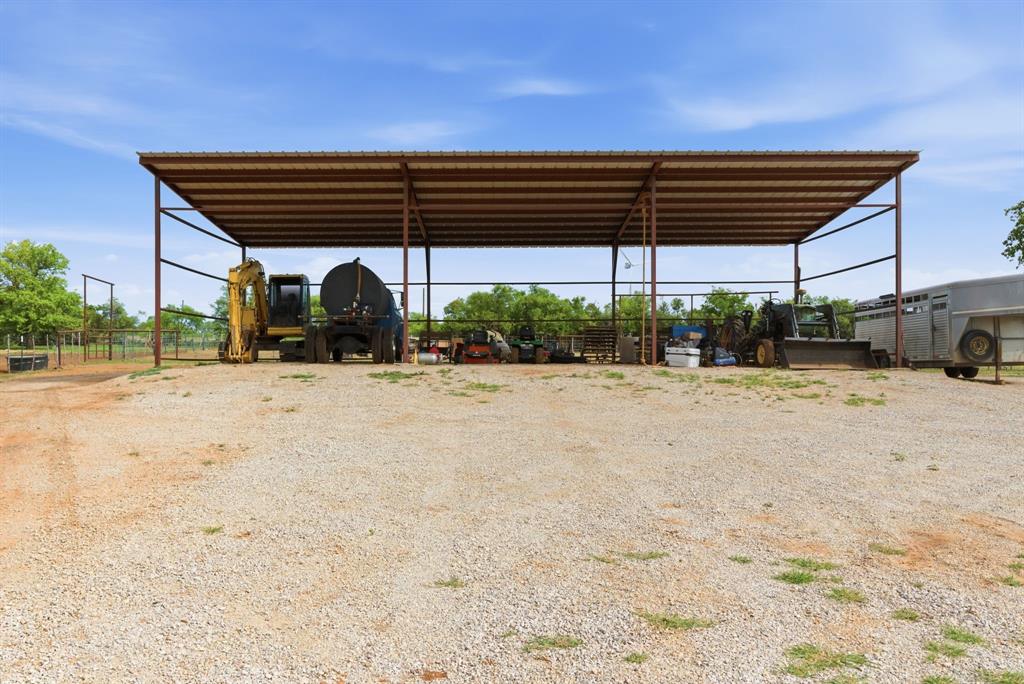 8315 County Road 403 Cisco, TX 76437 - Photo 21 of 40 a view of patio with a table and chairs under an umbrella