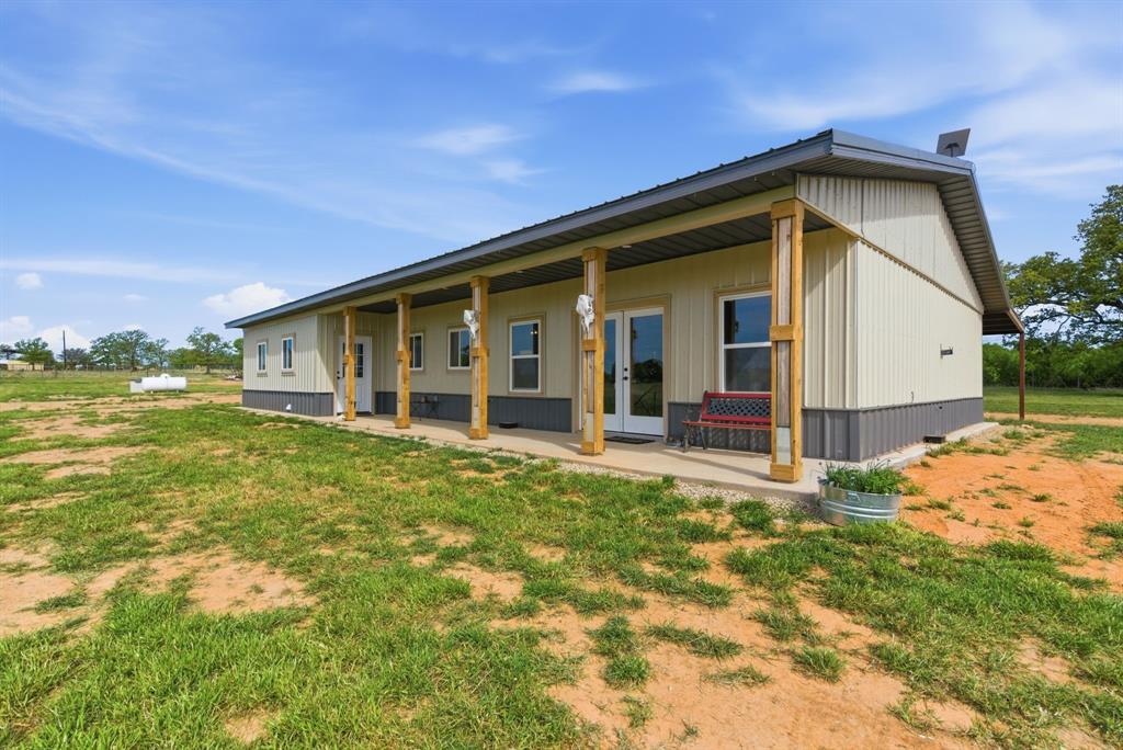 8315 County Road 403 Cisco, TX 76437 - Photo 23 of 40 a view of a house with backyard and garden